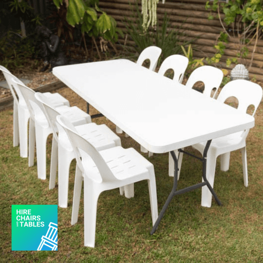white rectangle table with 8 monobloc chairs